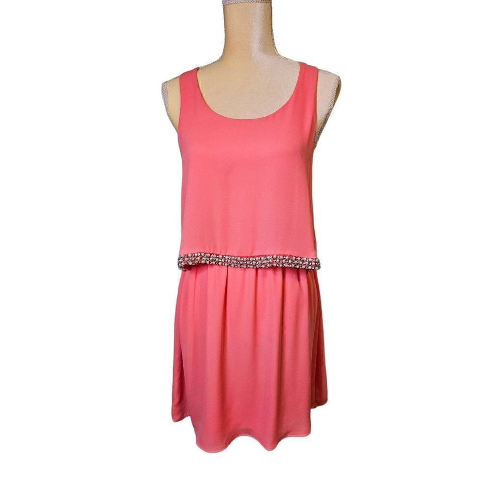 Dina be peach colored sleeveless dress. Size M.